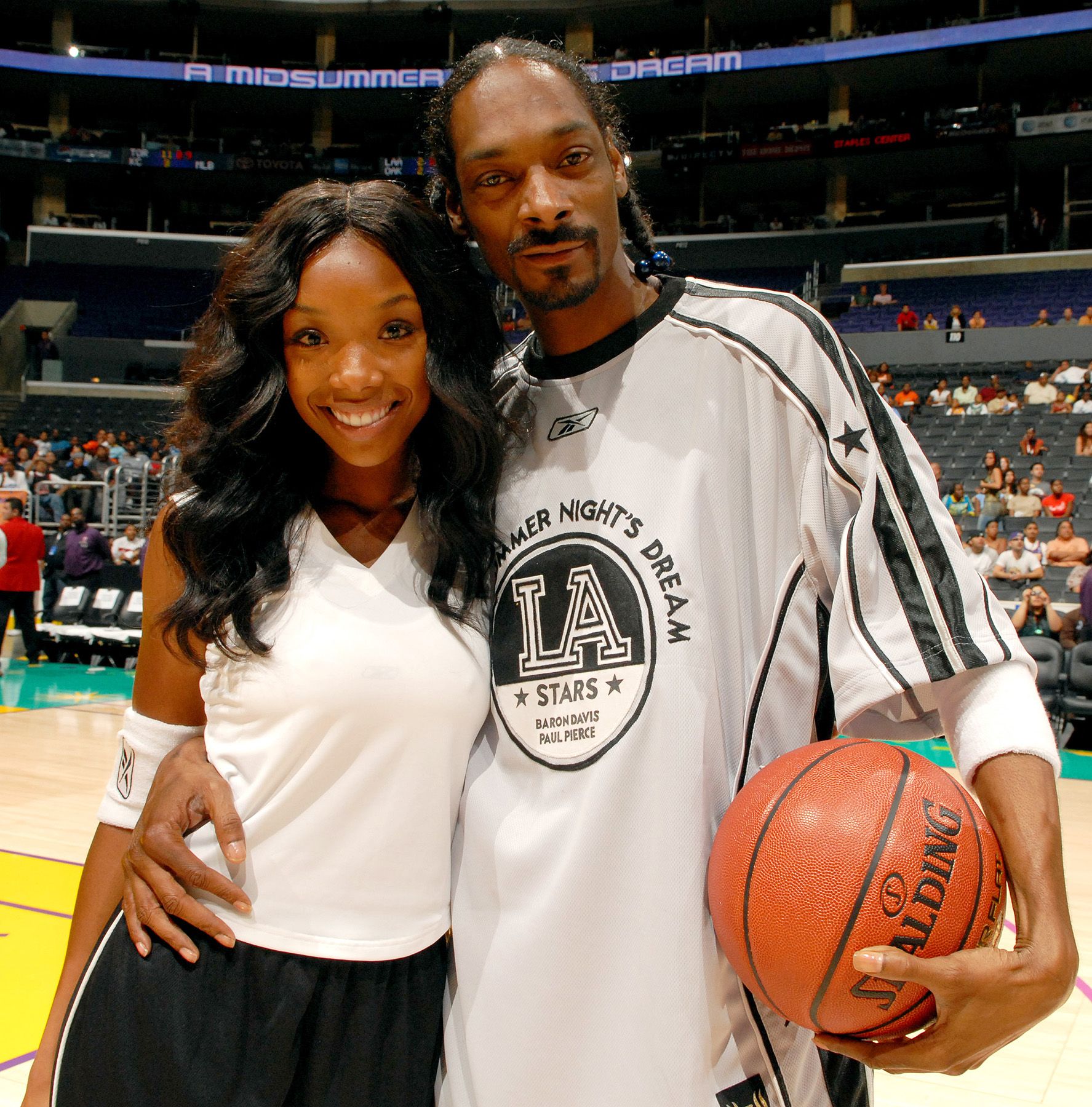 Brandy and Snoop Dogg pose before A Midsummer Night's Dream Celebrity and All-Star Basketball Game on July 9, 2006 at the Staples Center in Los Angeles, Calif. (Photo by M. Caulfield/WireImage)